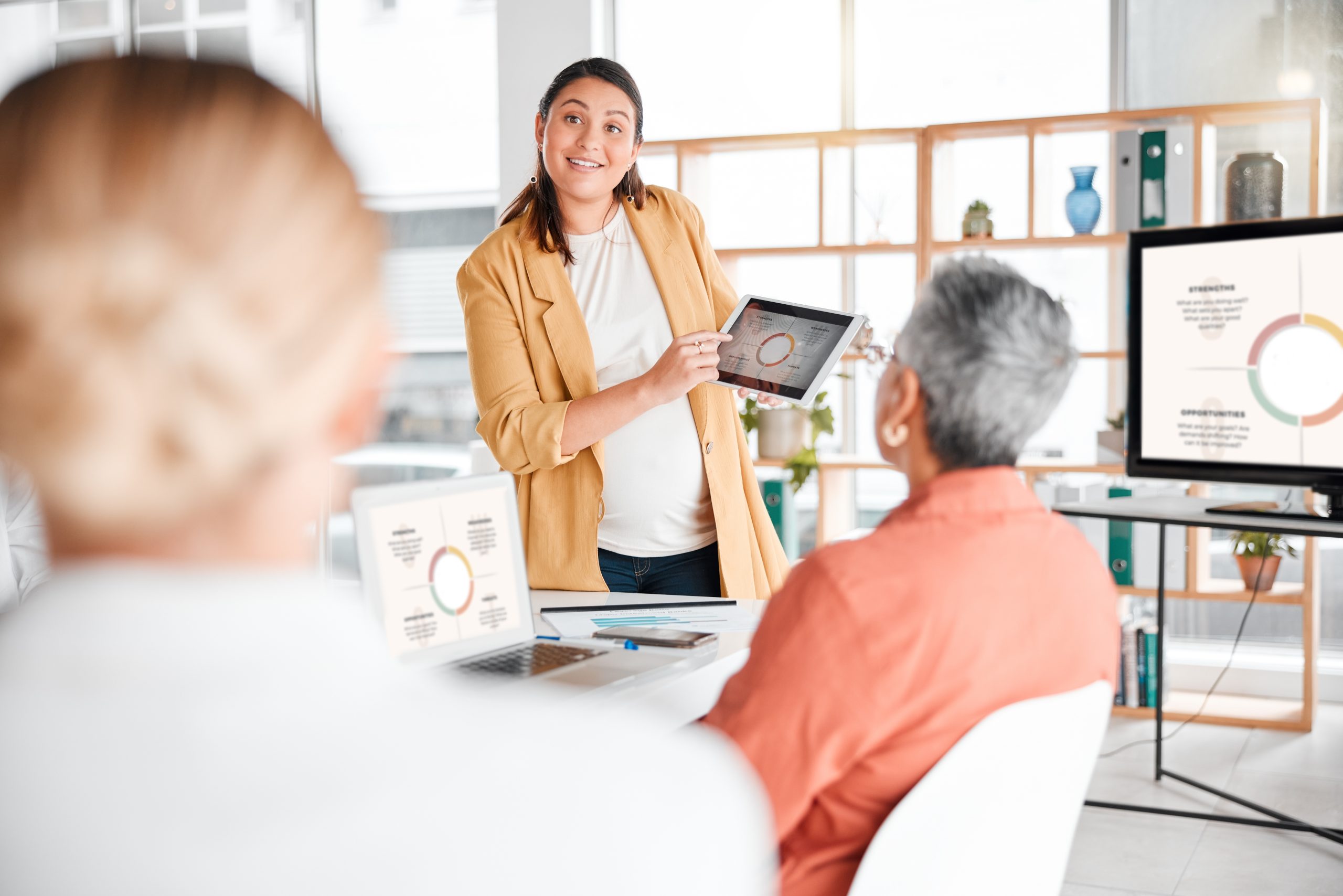 Tablet chart, teamwork or business people in meeting for company growth, strategy review or teamwor.